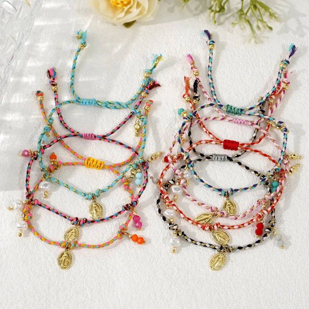 Close-up of a hand-woven colourful braided rope bracelet for women with an integrated fabric strap tag.