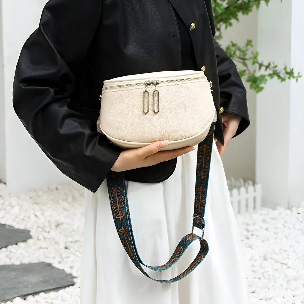 Women's soft PU leather casual messenger bag in saddle shape with single strap, shown in green colour.