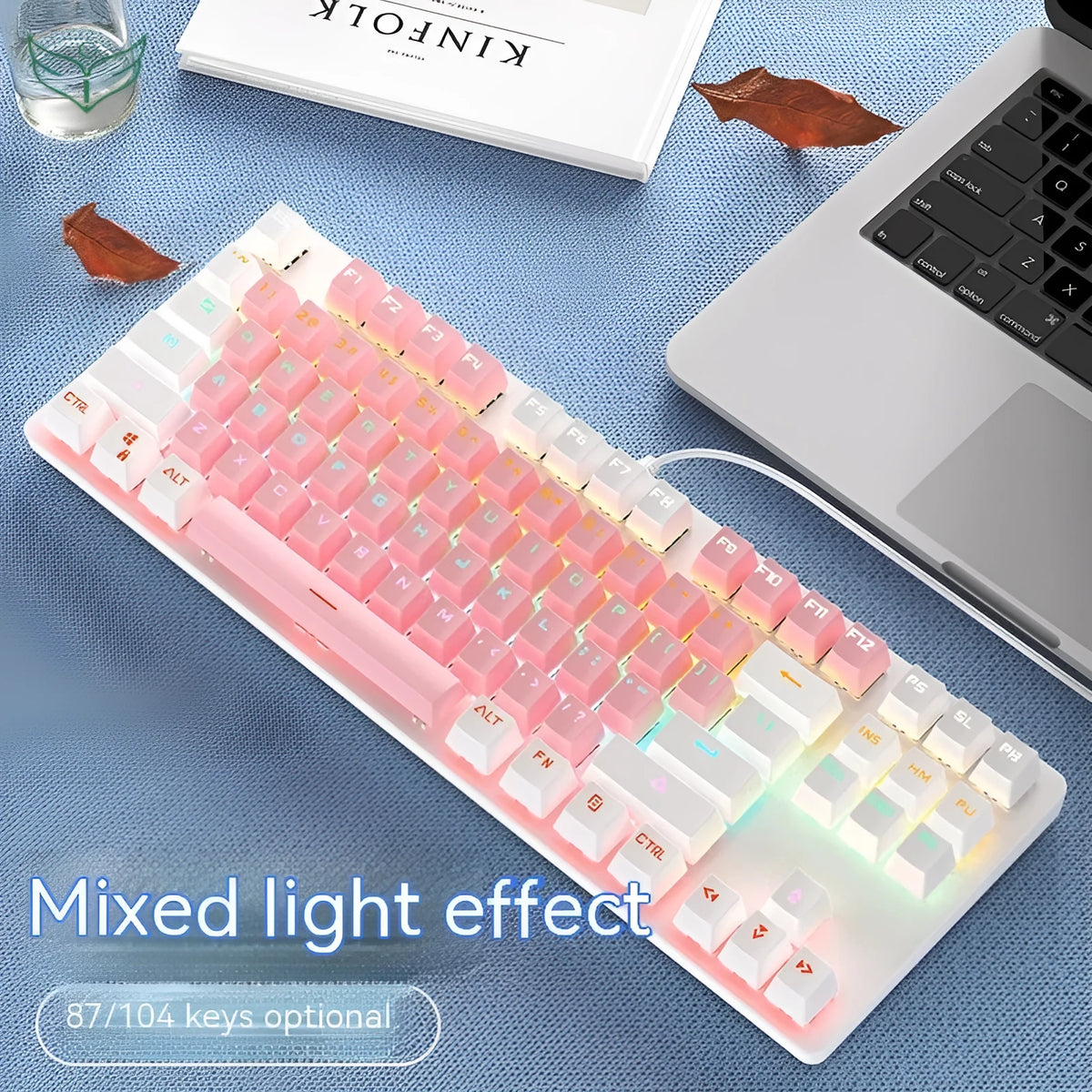 Red and black 87-key compact mechanical keyboard with green axis switches on a desk, shown with blue mixed light backlight