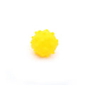 A bright blue spiky dog toy ball with a dimpled texture, shown next to a measuring tape indicating its 2-inch diameter.