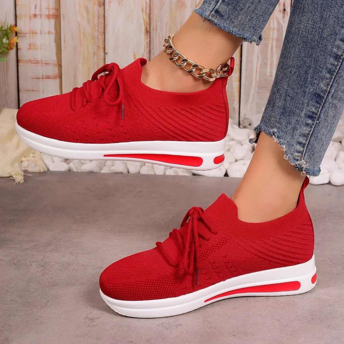 Women's low-top casual sneakers in red, black, or blue with round toe and lace-up front.