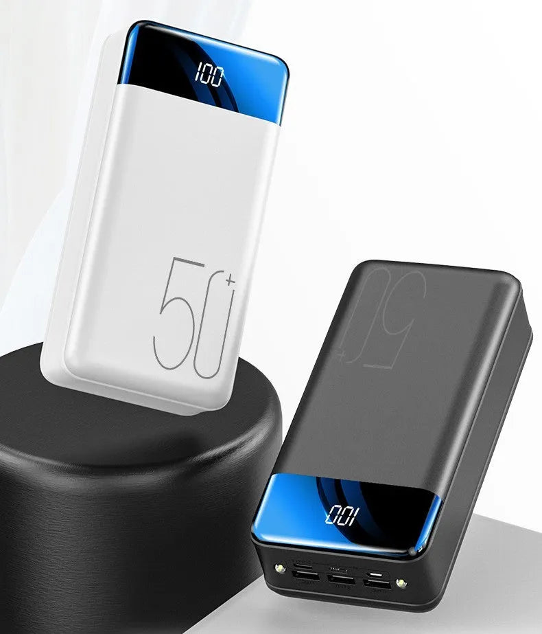 Black and white 50000mAh power bank showing three output USB ports and three input charging ports