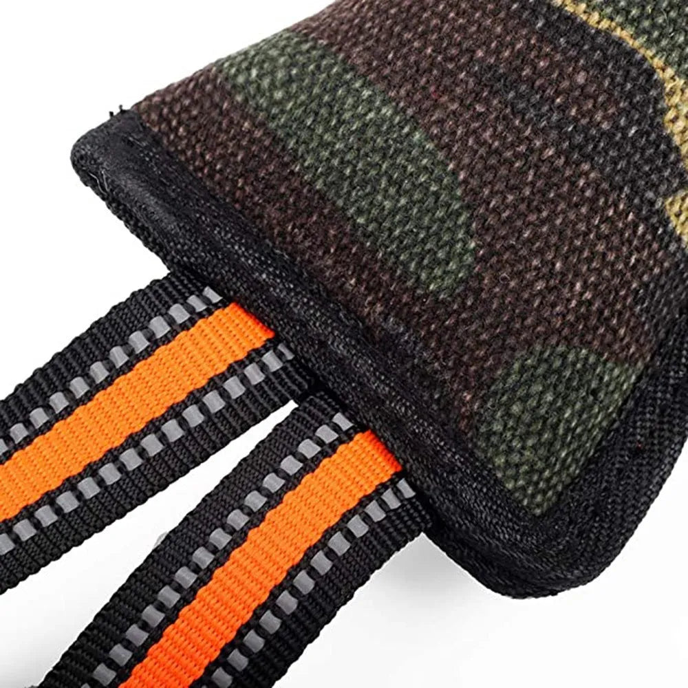 Reflective dog training jute bite stick with yellow edge, 55 cm length, on outdoor grass