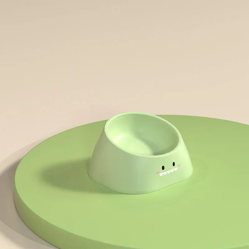 Green tilted stainless steel pet bowl showing 15-degree feeding angle