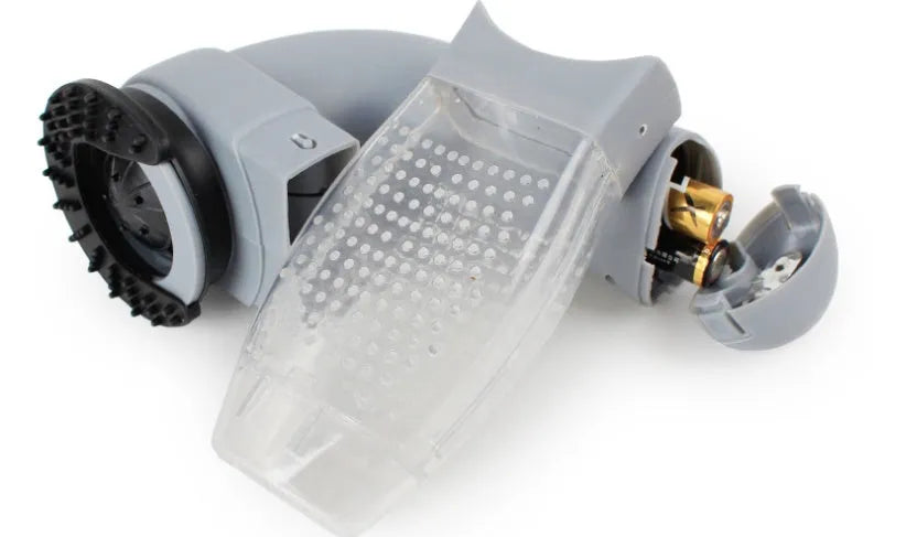 Grey portable electric pet hair vacuum cleaner with soft rubber brush head.