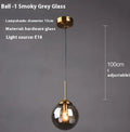 Modern Nordic style ceiling chandelier with spherical glass shades in clear, amber and grey.