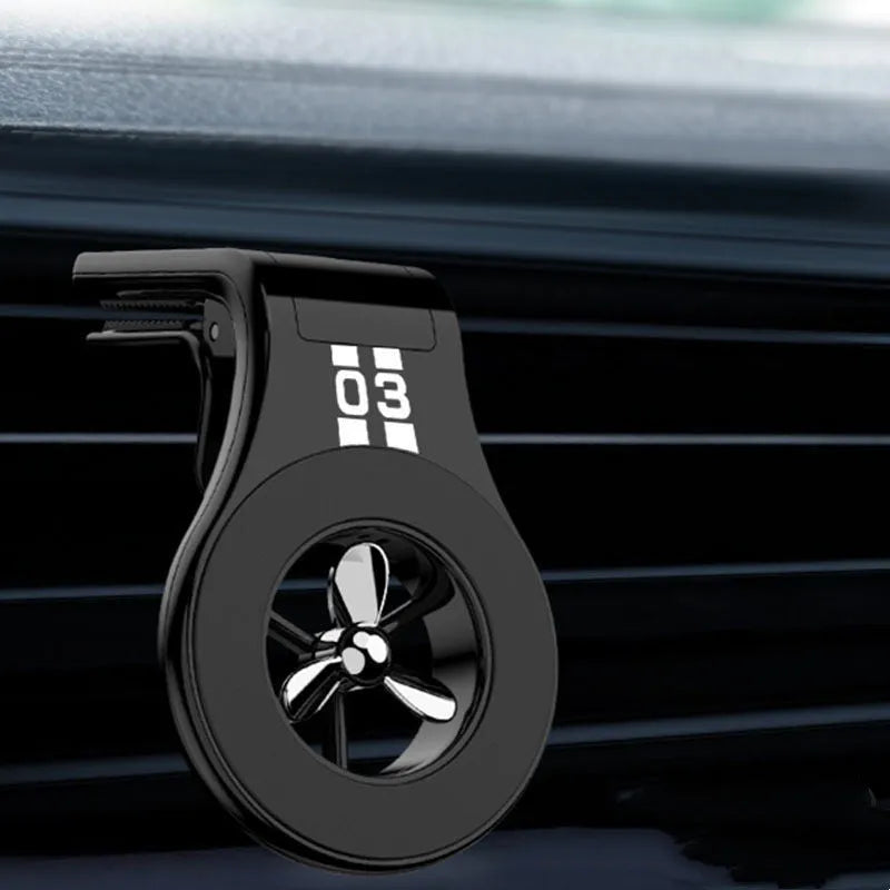Magnetic car phone holder attached to vehicle air vent with phone mounted