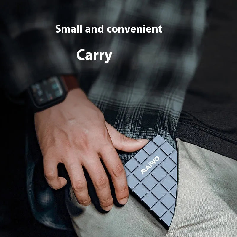 Compact aluminum USB4 external hard drive enclosure for M.2 NVMe SSDs on a desk.