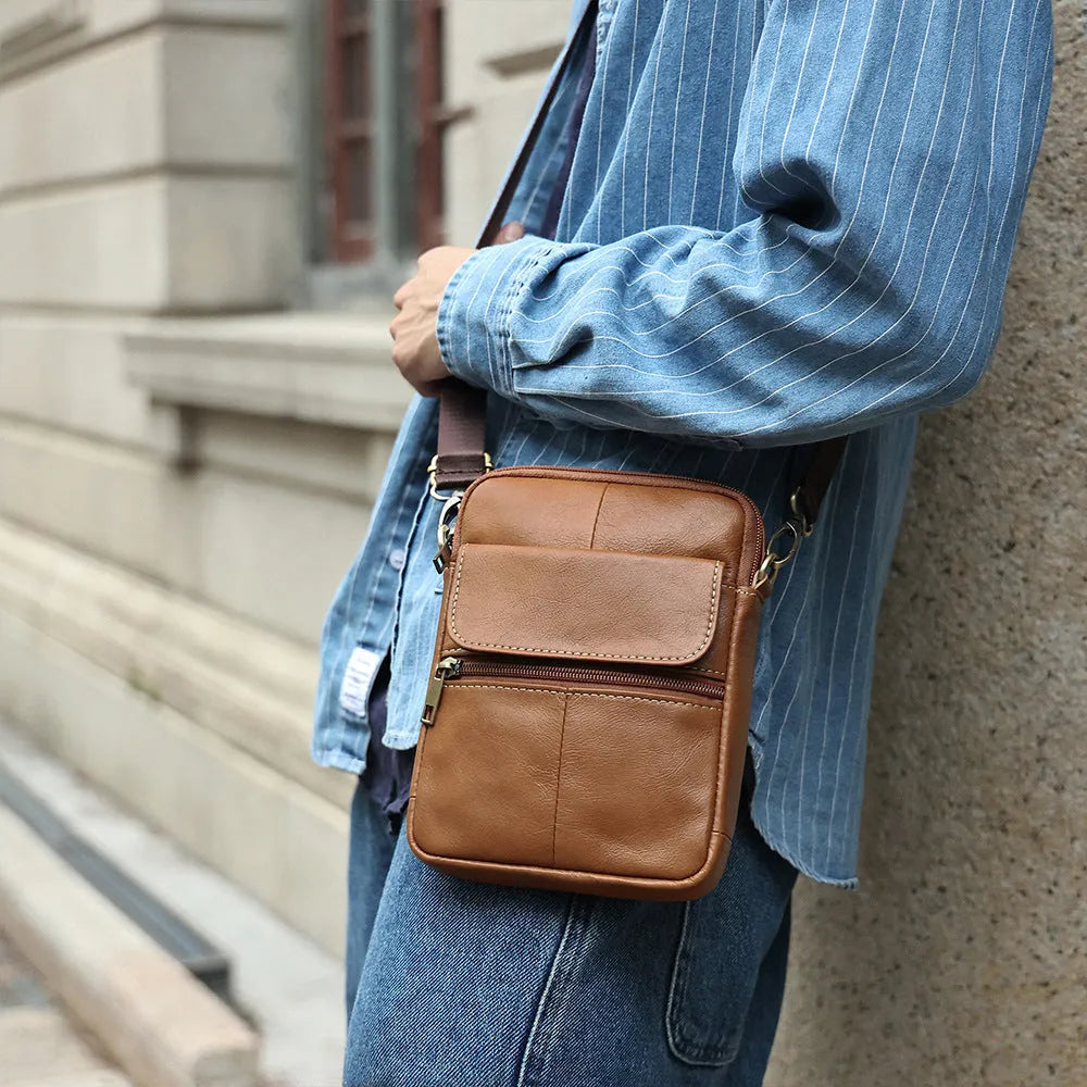 Men's brown leather crossbody shoulder bag with visible sewing detail