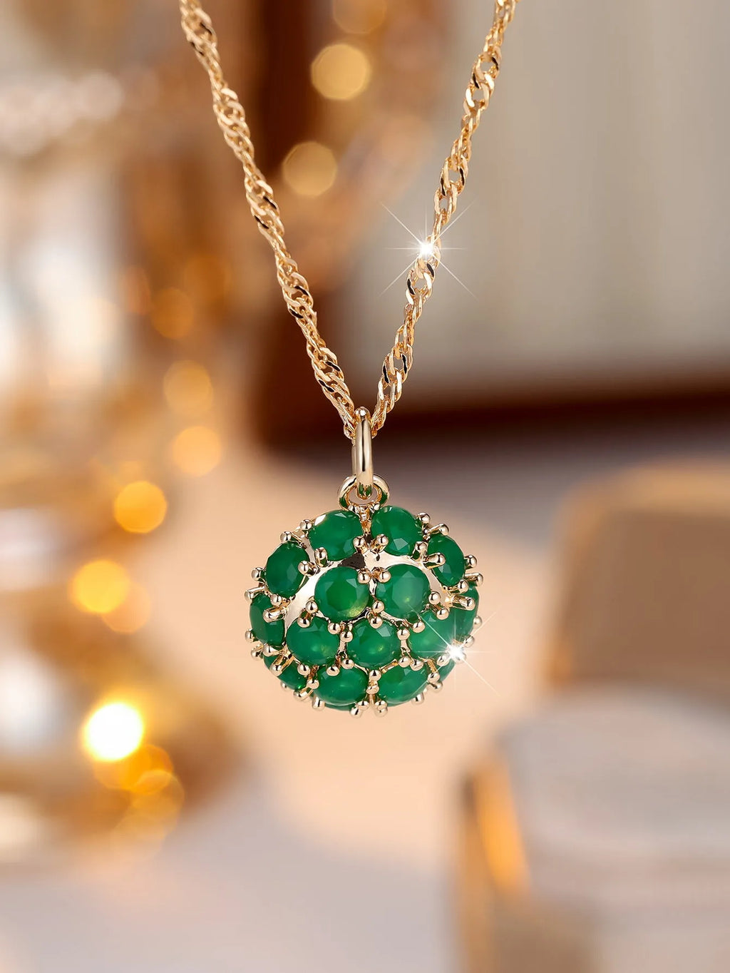 Golden green jade diamond women's necklace with round emerald pendant on an adjustable chain.