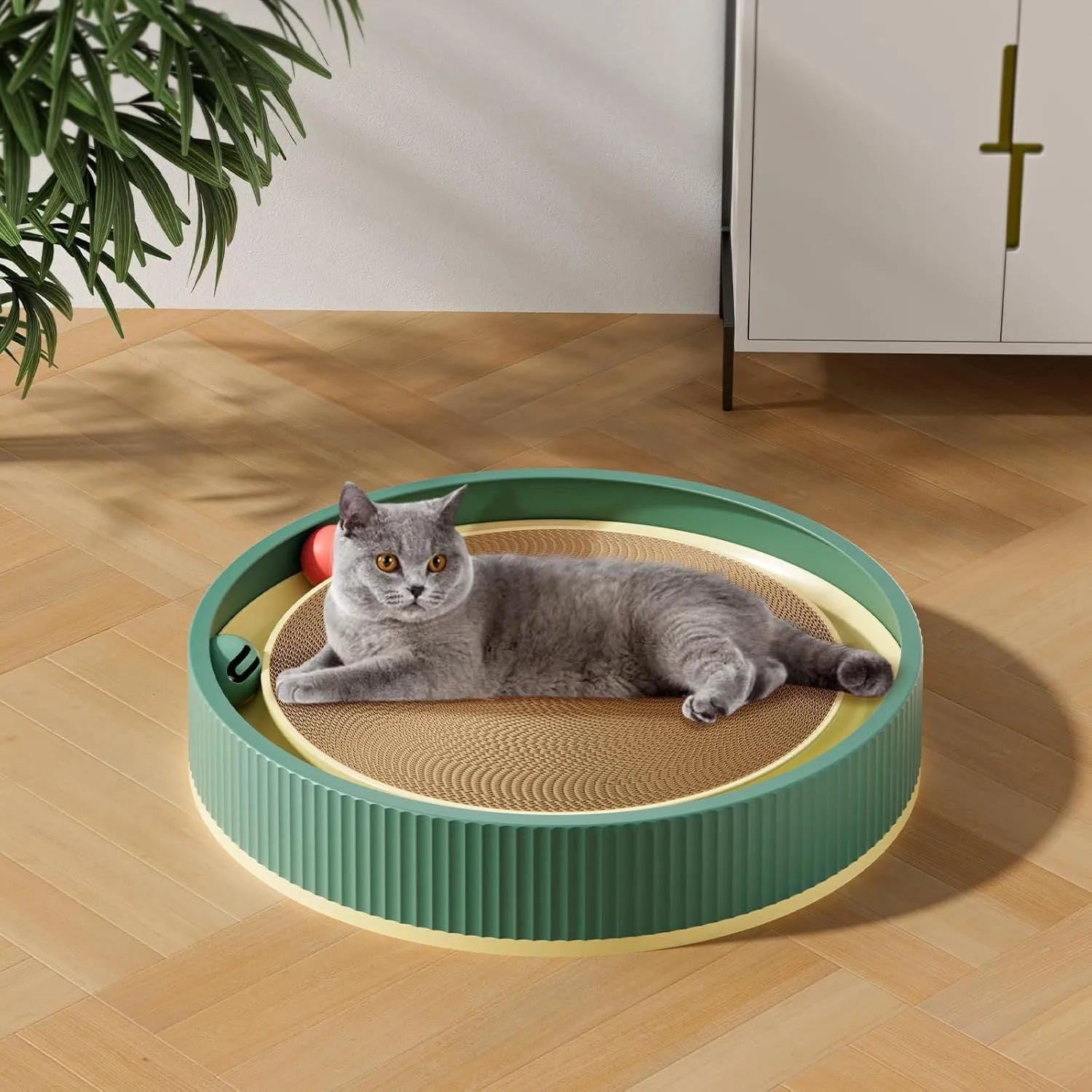 Large green cat scratching board with replaceable core, bell balls, and spring plush toy for indoor cats