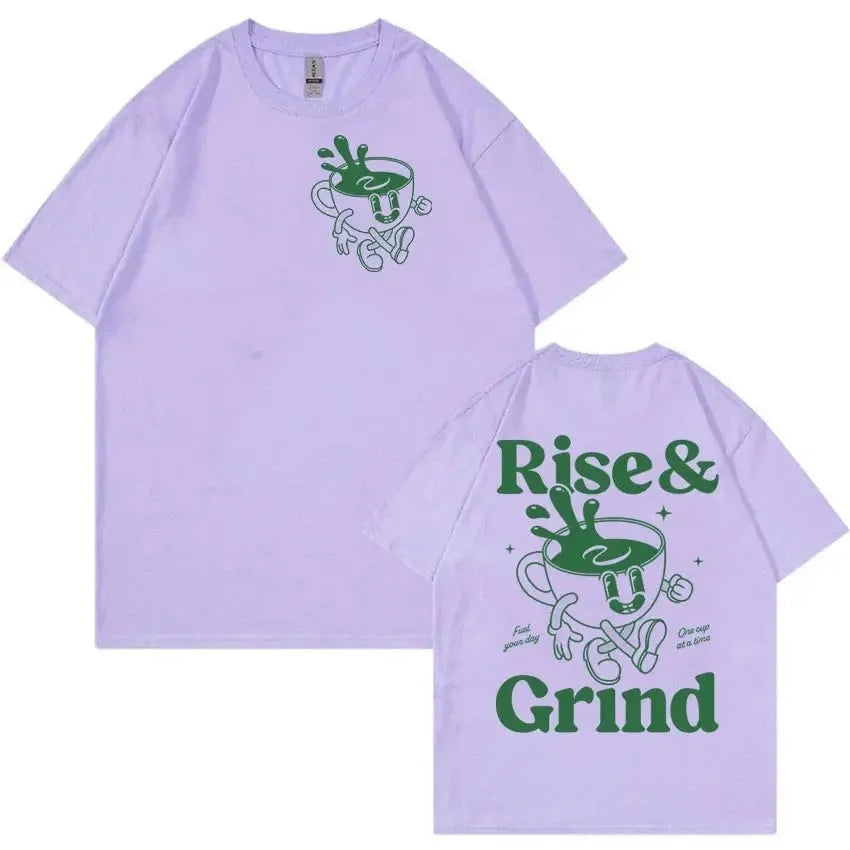 Man wearing a black loose-fit t-shirt with a green 'Rise And Grind' coffee cartoon graphic on the front.