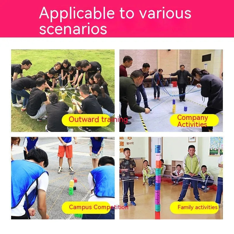 Outdoor team building equipment set with coloured plastic blocks, pull ropes, and a metal hook frame on grass.