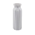 Green melamine plastic vase with 7.2cm base on a wooden table.