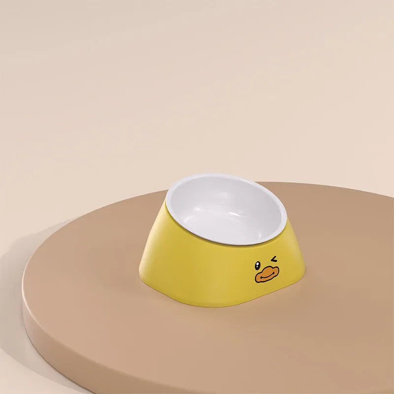 Green tilted stainless steel pet bowl showing 15-degree feeding angle