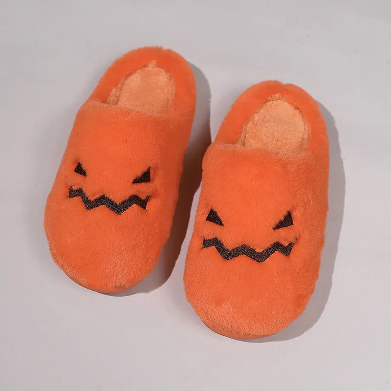 Orange Halloween pumpkin slippers with plush lining and textured PVC sole.