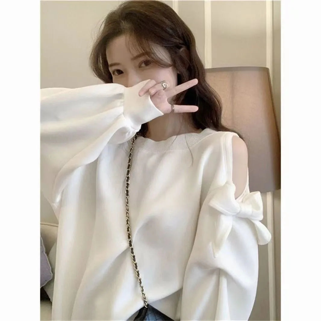 Women's casual solid colour cotton blend long sleeve loose fit top in white, front view