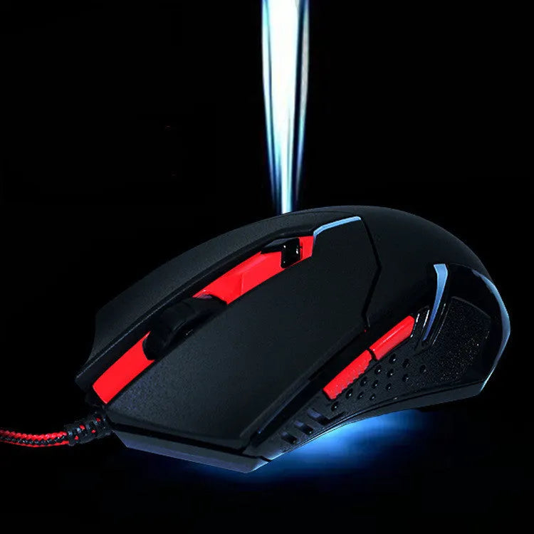 Black and red wired USB gaming mouse on a desk