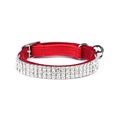 A velvet suede cat collar with rhinestone decoration, shown in an adjustable length from 20 to 30 cm.