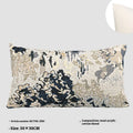 Antique blue abstract floral decorative pillow on a grey sofa, showing square and waist pillow sizes.