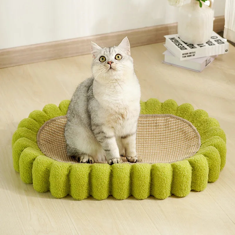 Green oval cat scratch pad and lounger bed made from sisal fabric.
