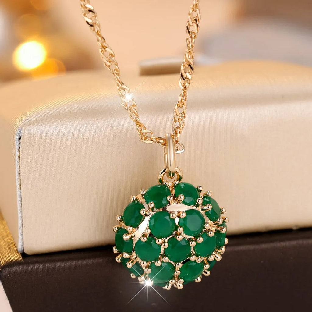 Golden green jade diamond women's necklace with round emerald pendant on an adjustable chain.