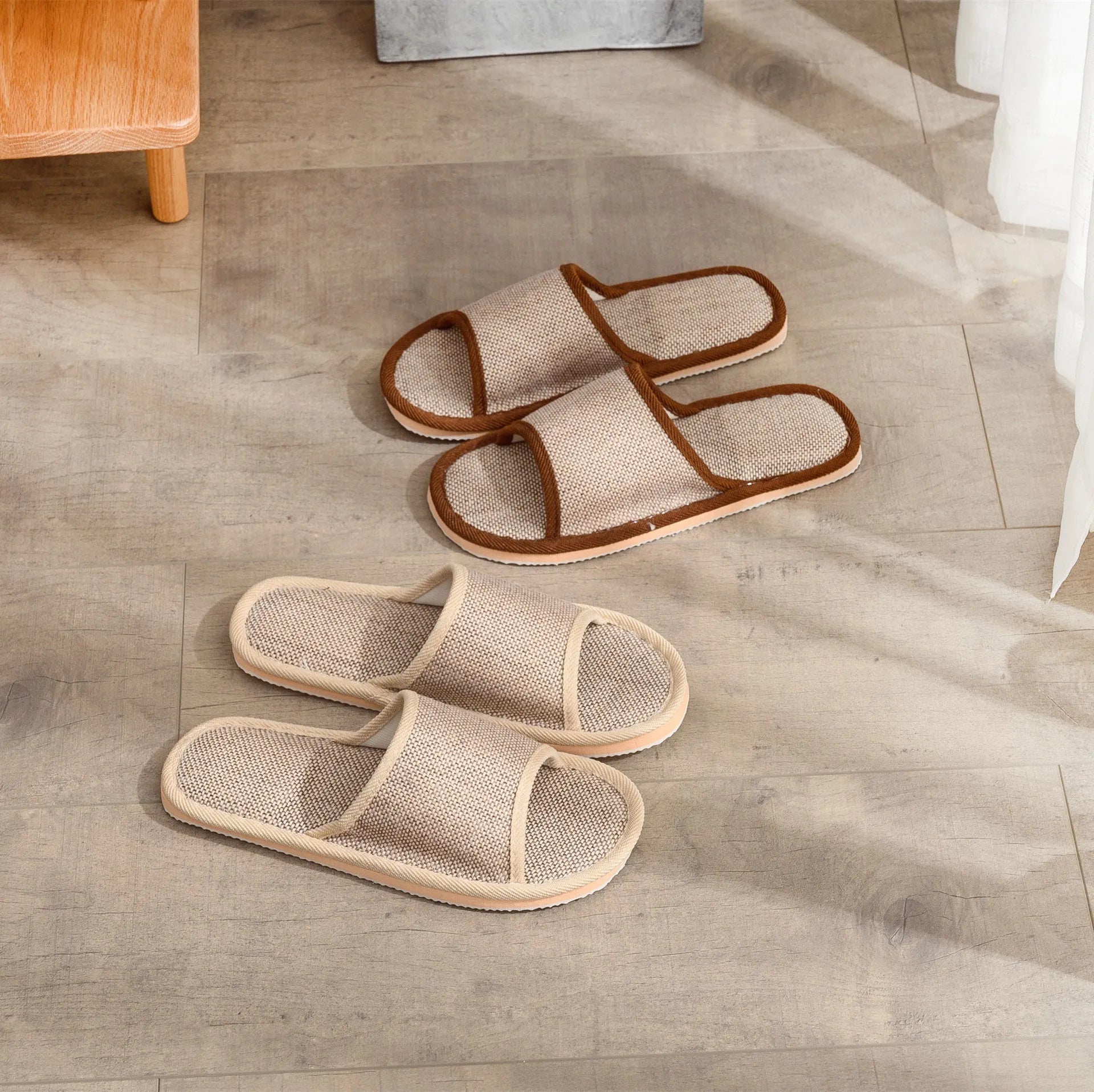 Women's open-toe linen slipper in a light brown colour, showing the breathable design and thickening sole.