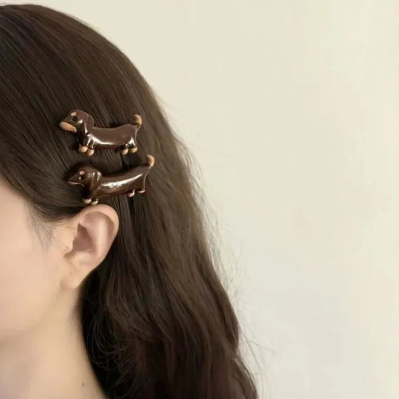 Dachshund dog design hair barrettes with electroplated finish, showing front and back views