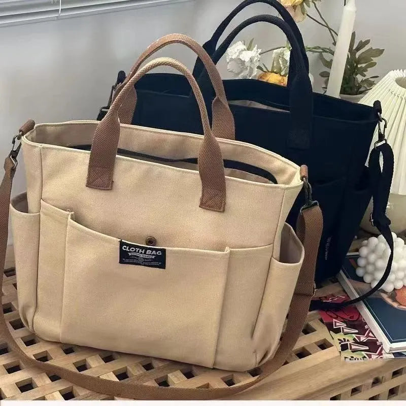 Canvas shoulder bag in khaki, 31cm wide, with handle and crossbody strap, urban simplicity style