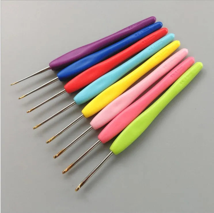 Complete set of 16 crochet hooks with soft and hard handles in a grey PU zippered bag.