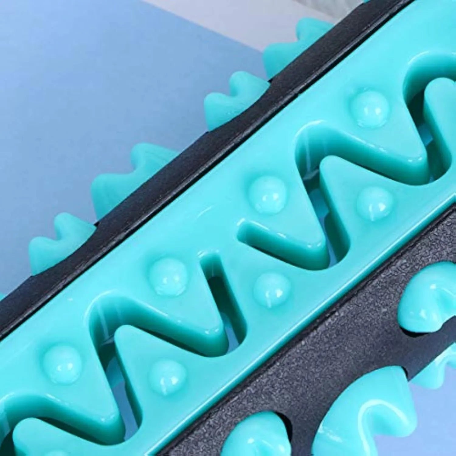 Natural rubber dog dental chew toy in blue colour with textured cleaning surfaces.