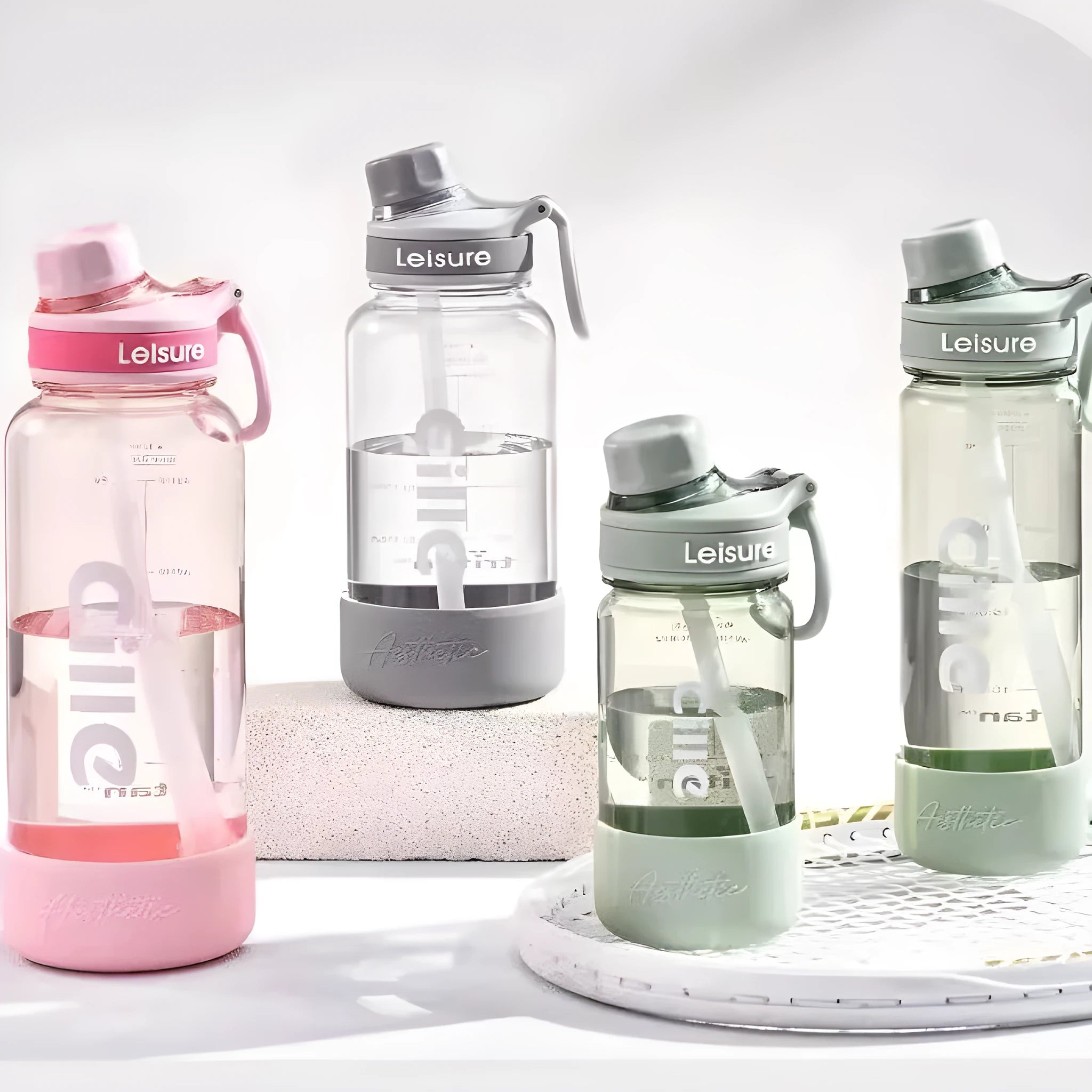 Grey, green and pink heat-resistant plastic straw cups in 520ml, 780ml and 1000ml sizes.