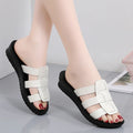 Beige flat-bottom women's slippers with viscose upper and PU sole, shown in a large size.