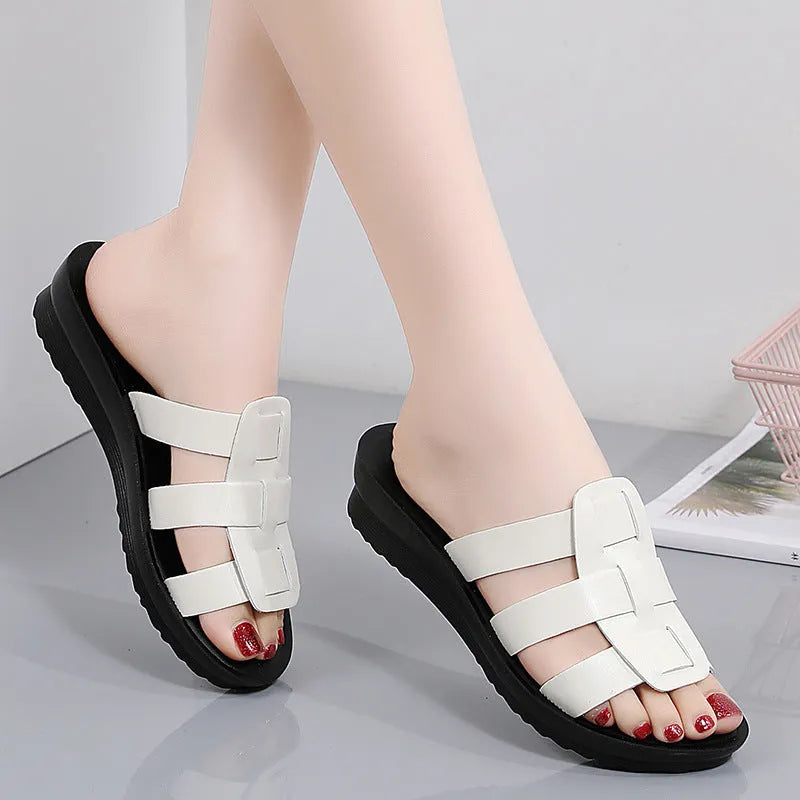 Beige flat-bottom women's slippers with viscose upper and PU sole, shown in a large size.