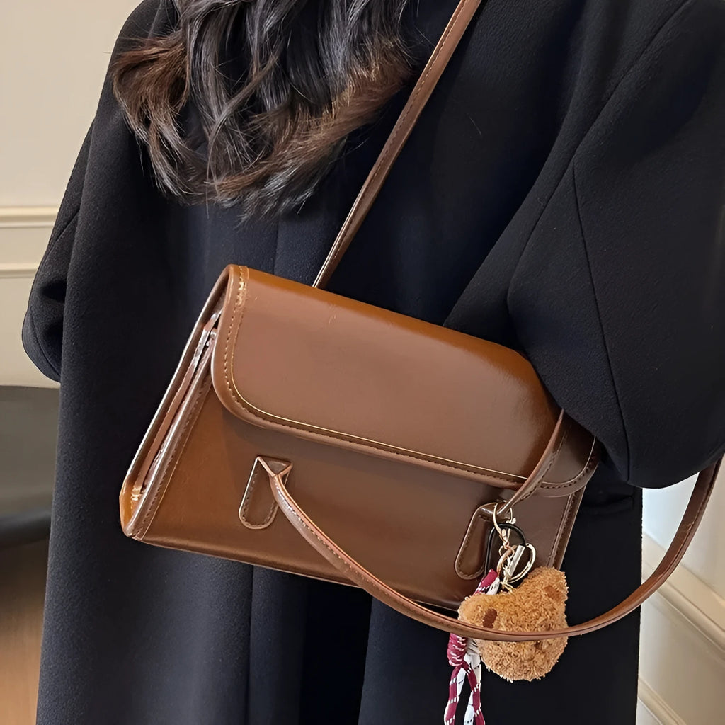 Brown women's PU Maillard handbag with pendant detail, horizontal square shape, and double shoulder straps