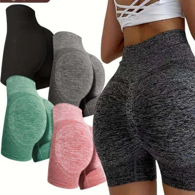 Woman wearing high-waisted black quick-dry yoga fitness shorts with a seamless waistband.