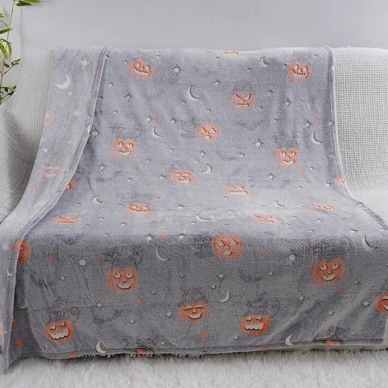 Cartoon-pattern flannel blanket laid flat, showing one of five colour options, suitable as a child's blanket or AC cover.