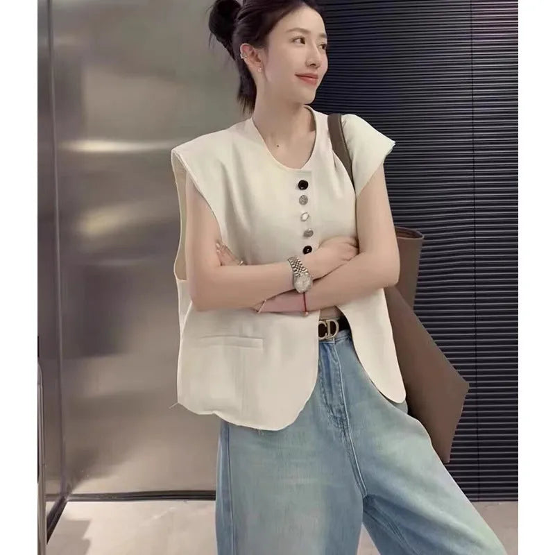 Women's loose fit polyester vest with pocket details in milky white colour