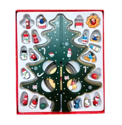 Hand-painted wooden Christmas tree decoration in red and green colours on desktop