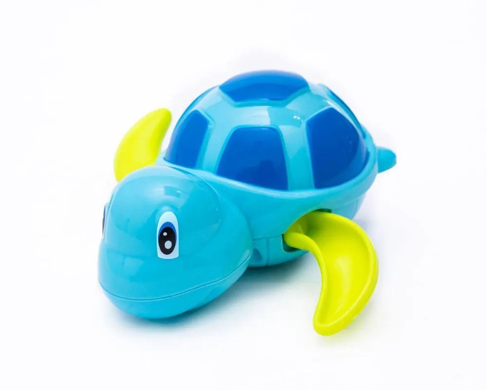 Yellow wind-up plastic turtle water toy on blue surface, 12cm clockwork mechanism
