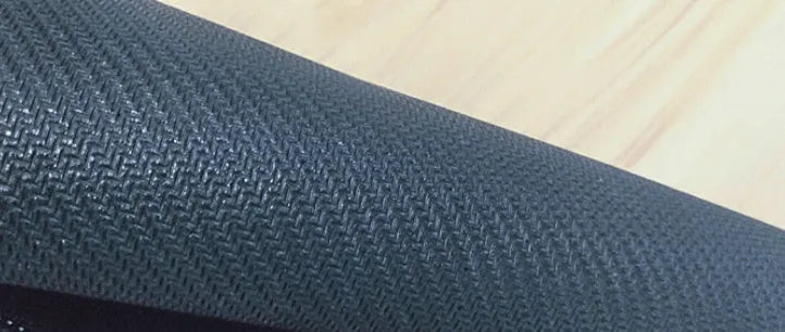 Large desk pad mouse mat with patterned design and non-slip natural rubber base on a wooden desk.