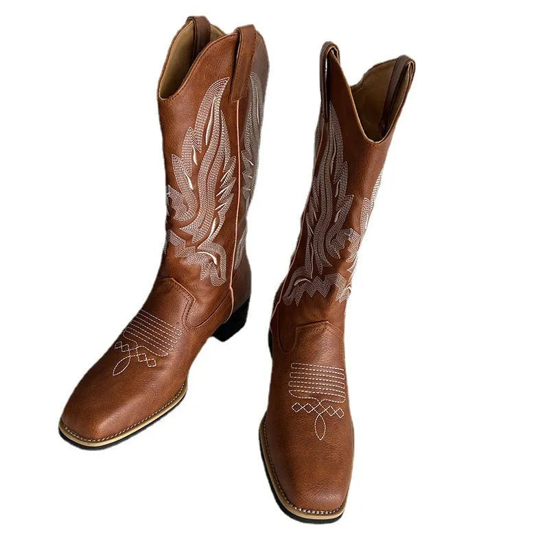 Brown women's embroidered leather mid-calf boots with round toe and low square heel.