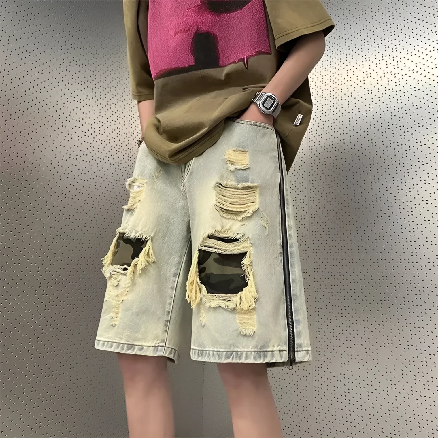 Men's camouflage pattern denim shorts with distressed rip detailing in yellow mud colour