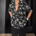 Men's black floral print short sleeve casual shirt with a loose fit and V-neck.