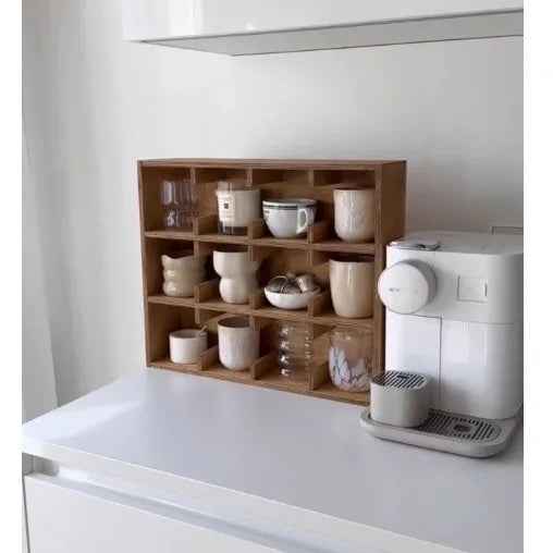 Square wooden storage rack with multiple grid compartments for cups in a birch wood finish.