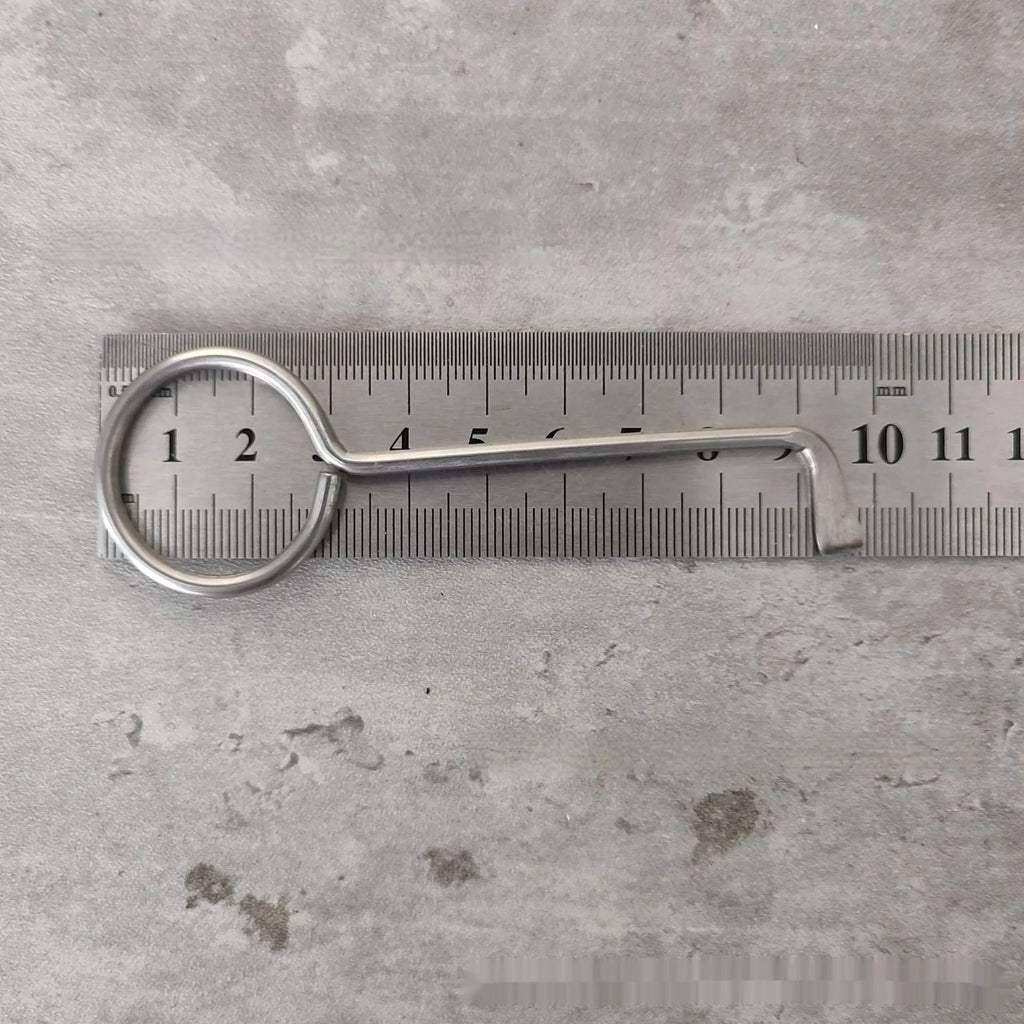 Two alloy wrench tools from a portable household tool set on a plain background.