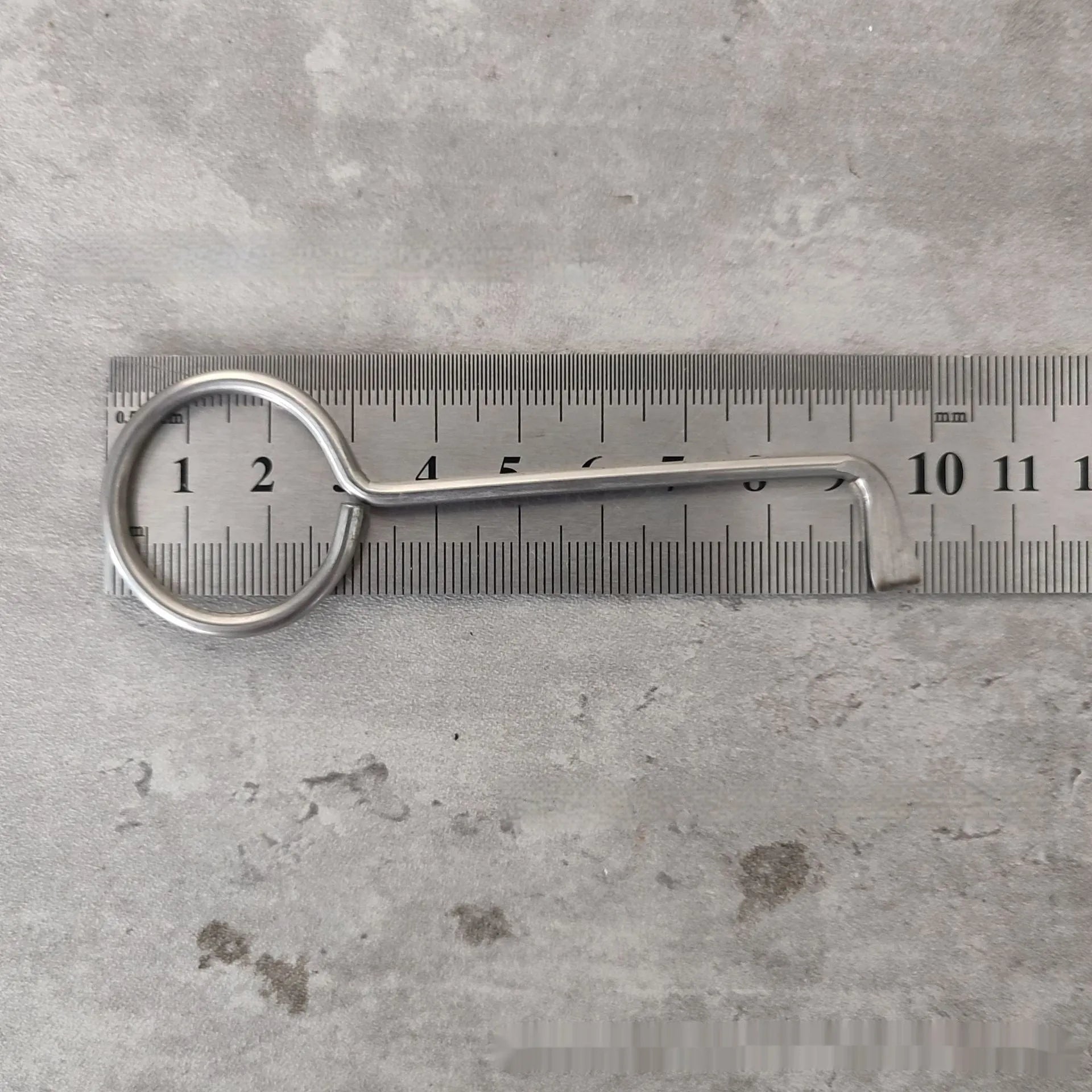 Two alloy wrench tools from a portable household tool set on a plain background.