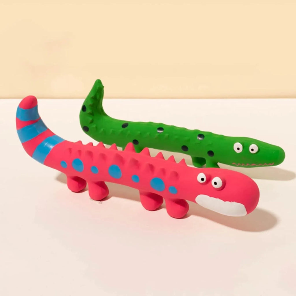 Green lizard-shaped dog chew toy with squeaker on a white background.