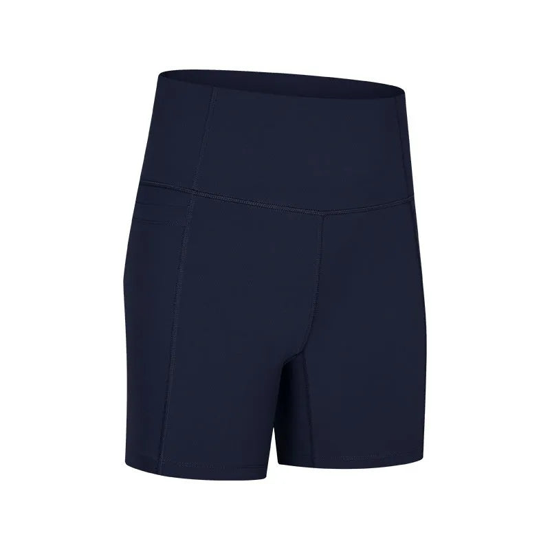 Women's tight-fit cotton blend sports shorts in light purple lotus colour, showing short fifth pants length.