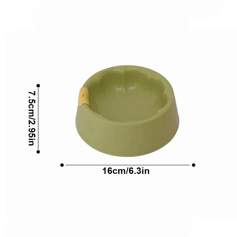 Green plastic double pet bowl for cats and dogs with anti-tipping base and separate food and water compartments